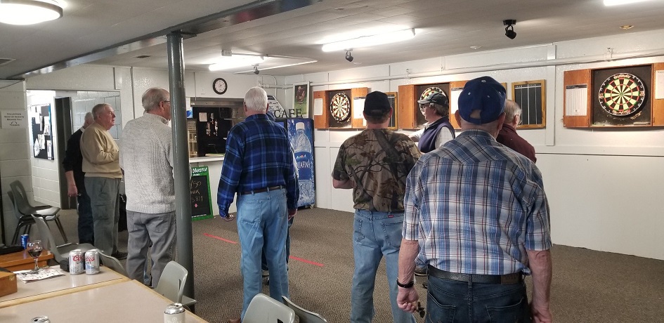 Gentlemen playing darts